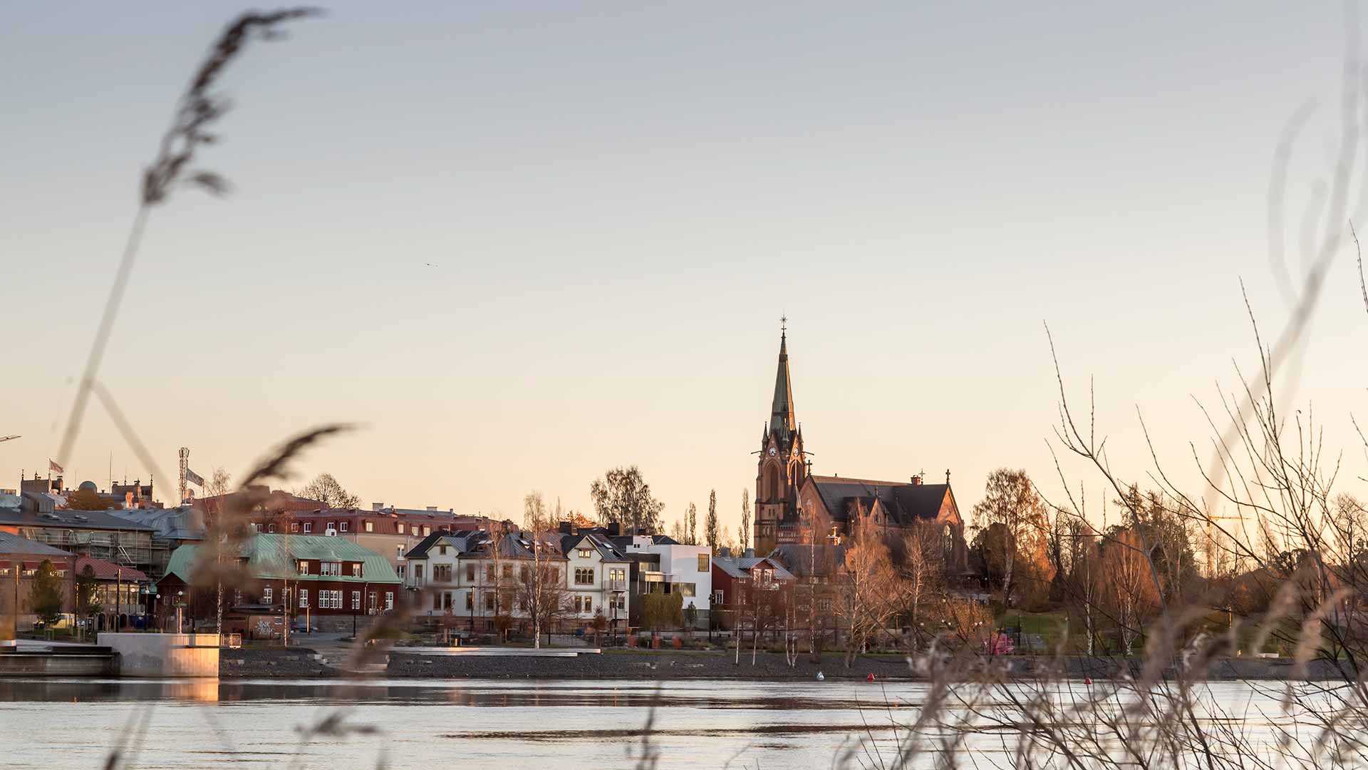 Umeå at dusk: the city church above the Ume River